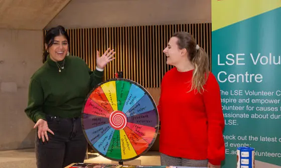 Two members of the Volunteer Centre's staff at a stall