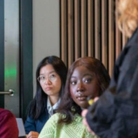 Students look at a teacher