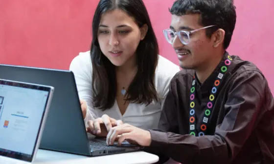 Students working together on a laptop