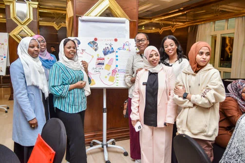 Sudanese Women Leadership in Global Uncertainty Highlight video Women Standing Infront of a board