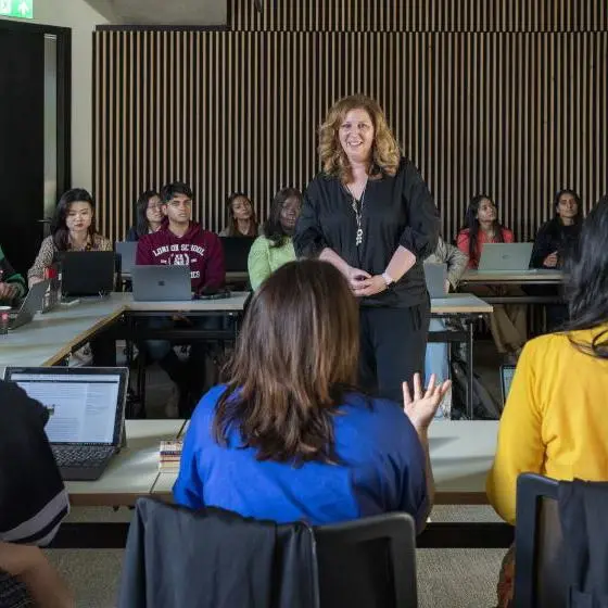 An LSE lecturer teaching a class of students