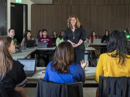 An LSE lecturer teaching a class of students