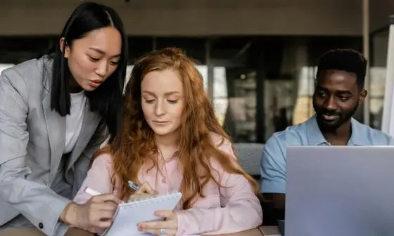 People offering support, looking through some notes
