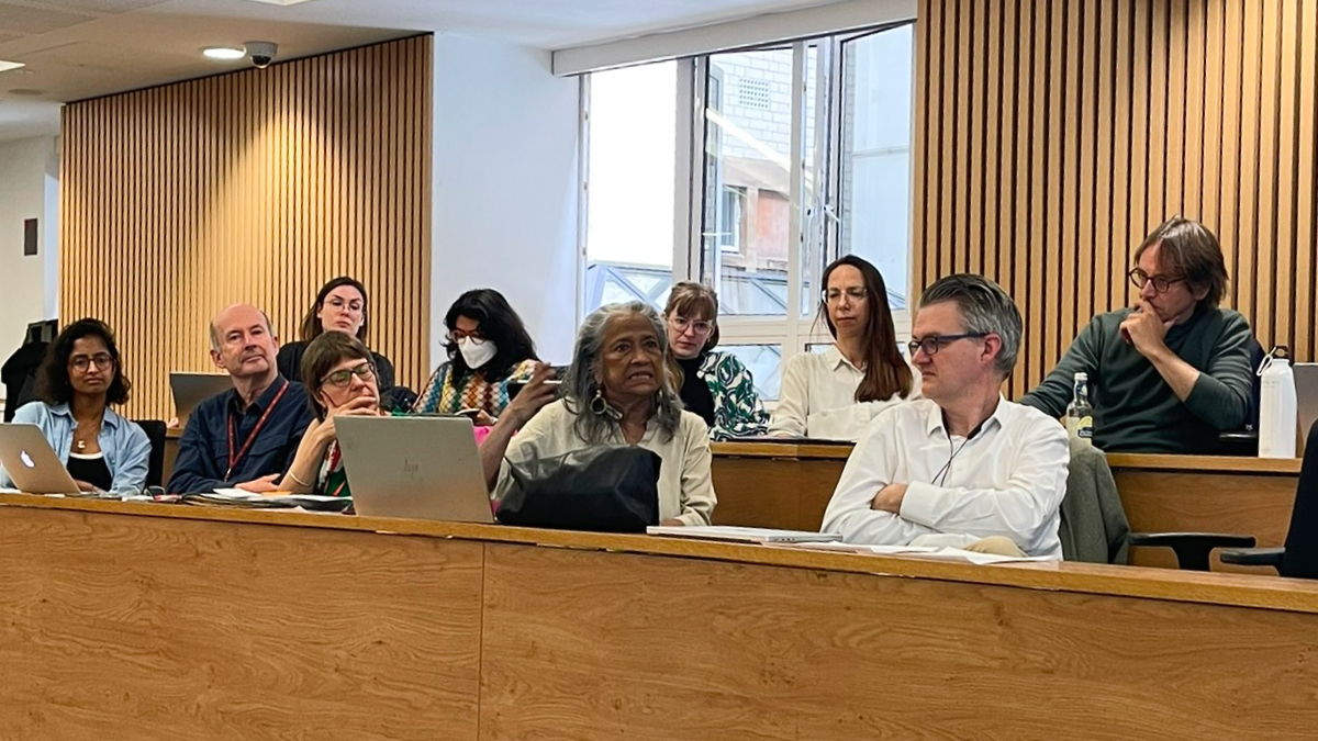 delegates at a workshop sit and listen to a speaker