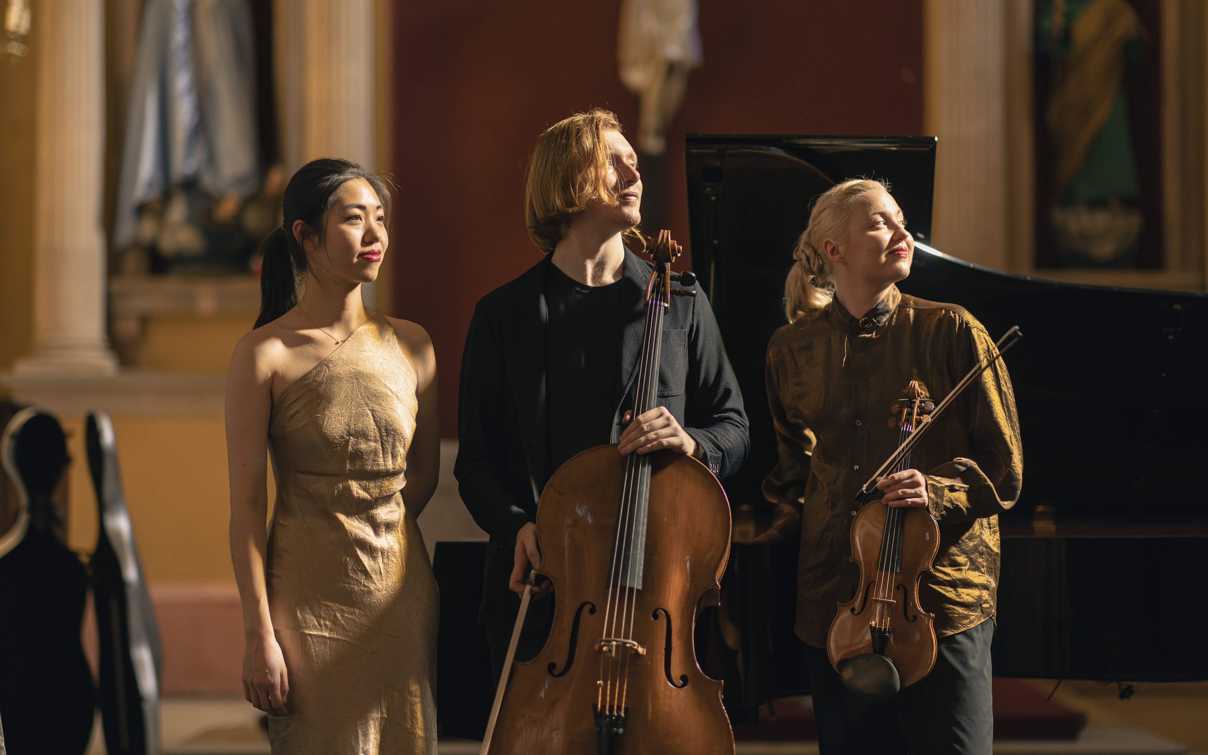 The Paddington Trio posing with their instruments