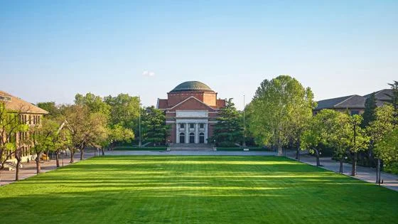 Auditorium building Tsinghua University under clear blue sky