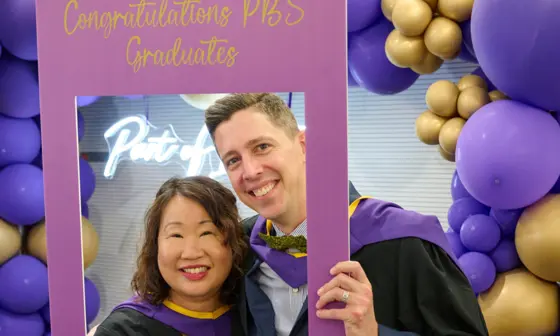 Two Executive MSc Behavioural Science students at graduation