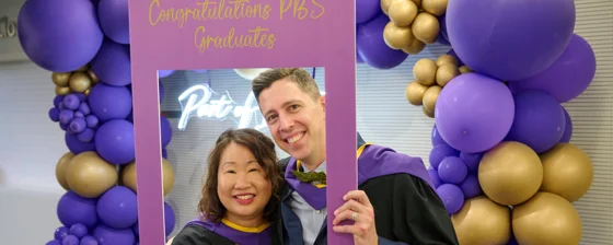 Two Executive MSc Behavioural Science students at graduation