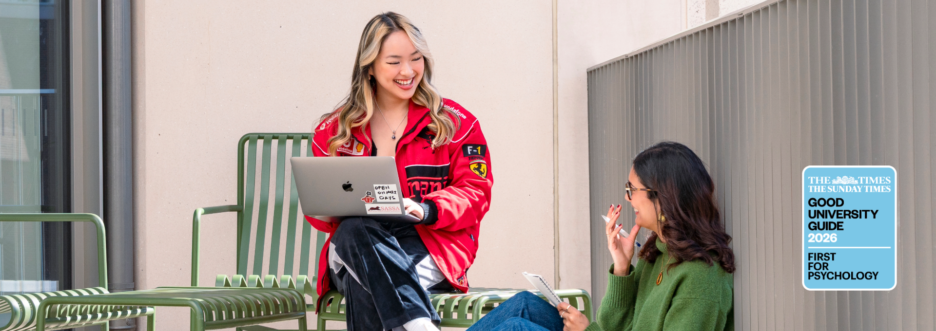 Two PBS students talking on a terrace