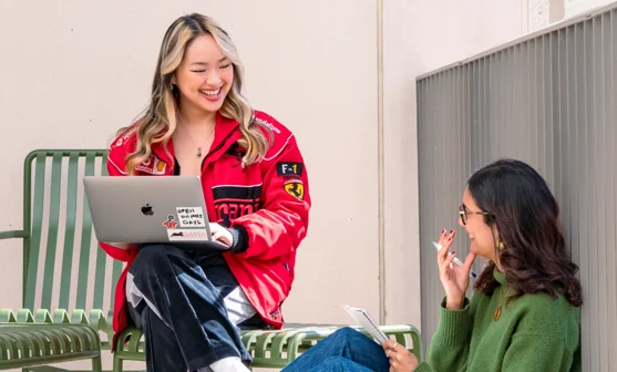 Two PBS students talking on a terrace