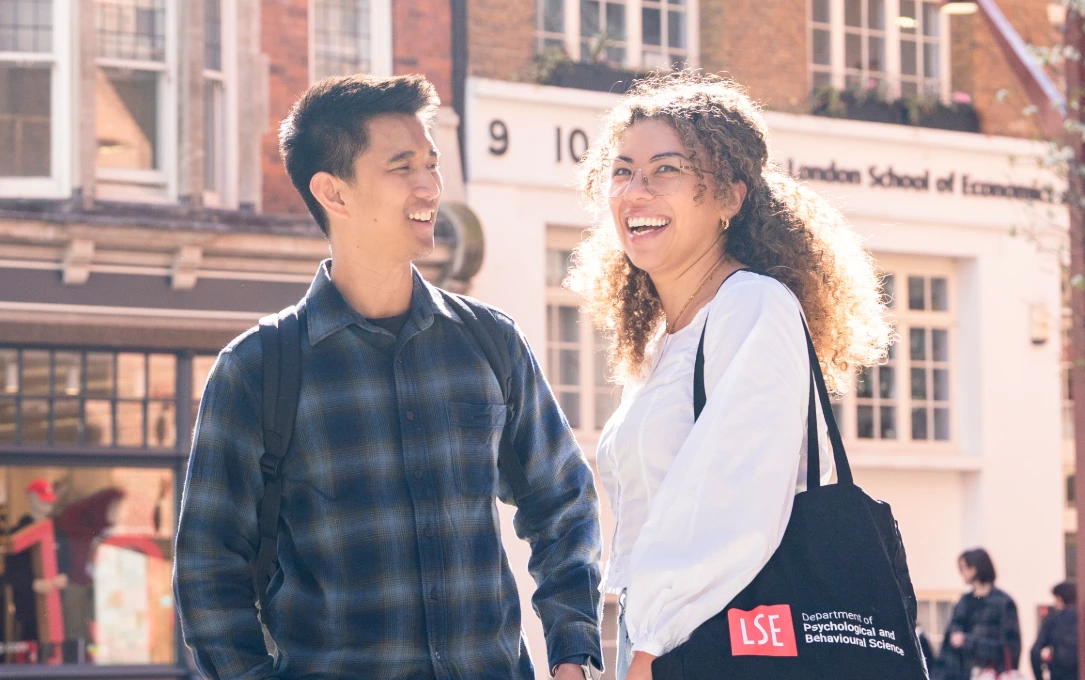 Two PBS students talking on campus