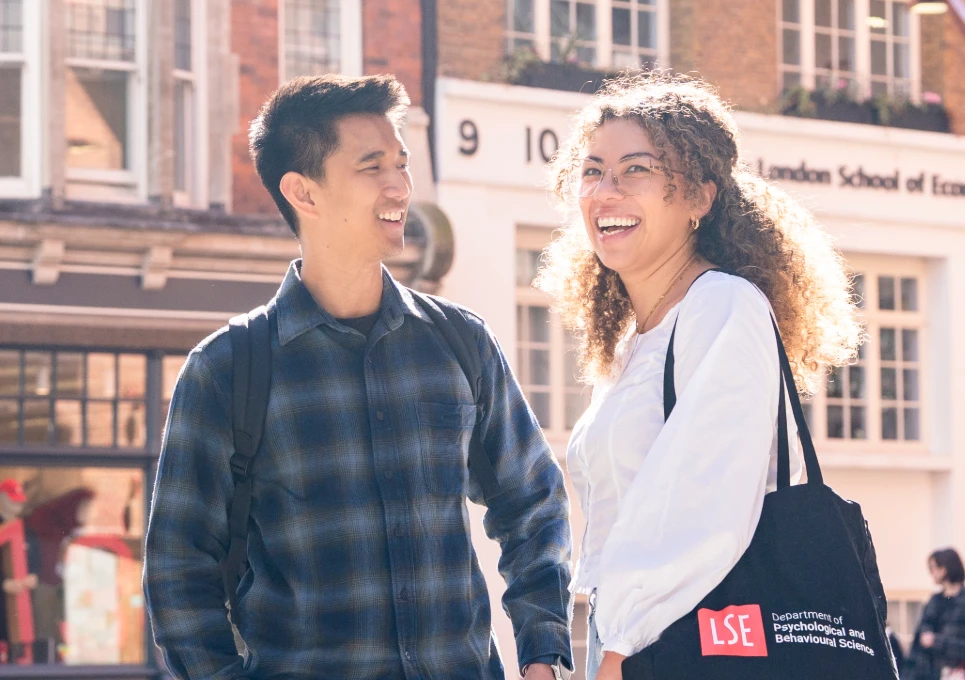 Two PBS students talking on campus