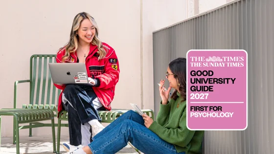 Two PBS students talking with GuG 2027 logo