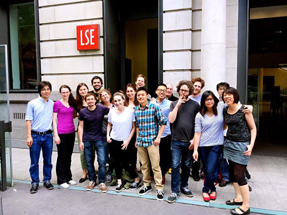 group photo of masters students stood outside an LSE building