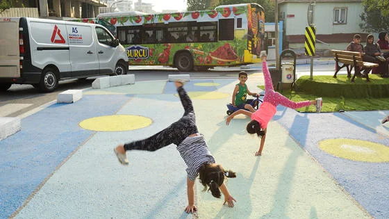 Children playing on the ground in a public play area