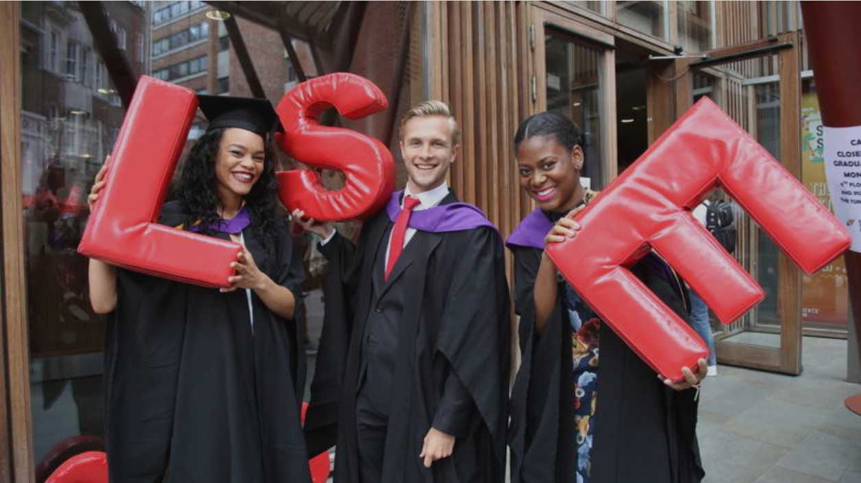 Students stood holding large lettters (LSE)