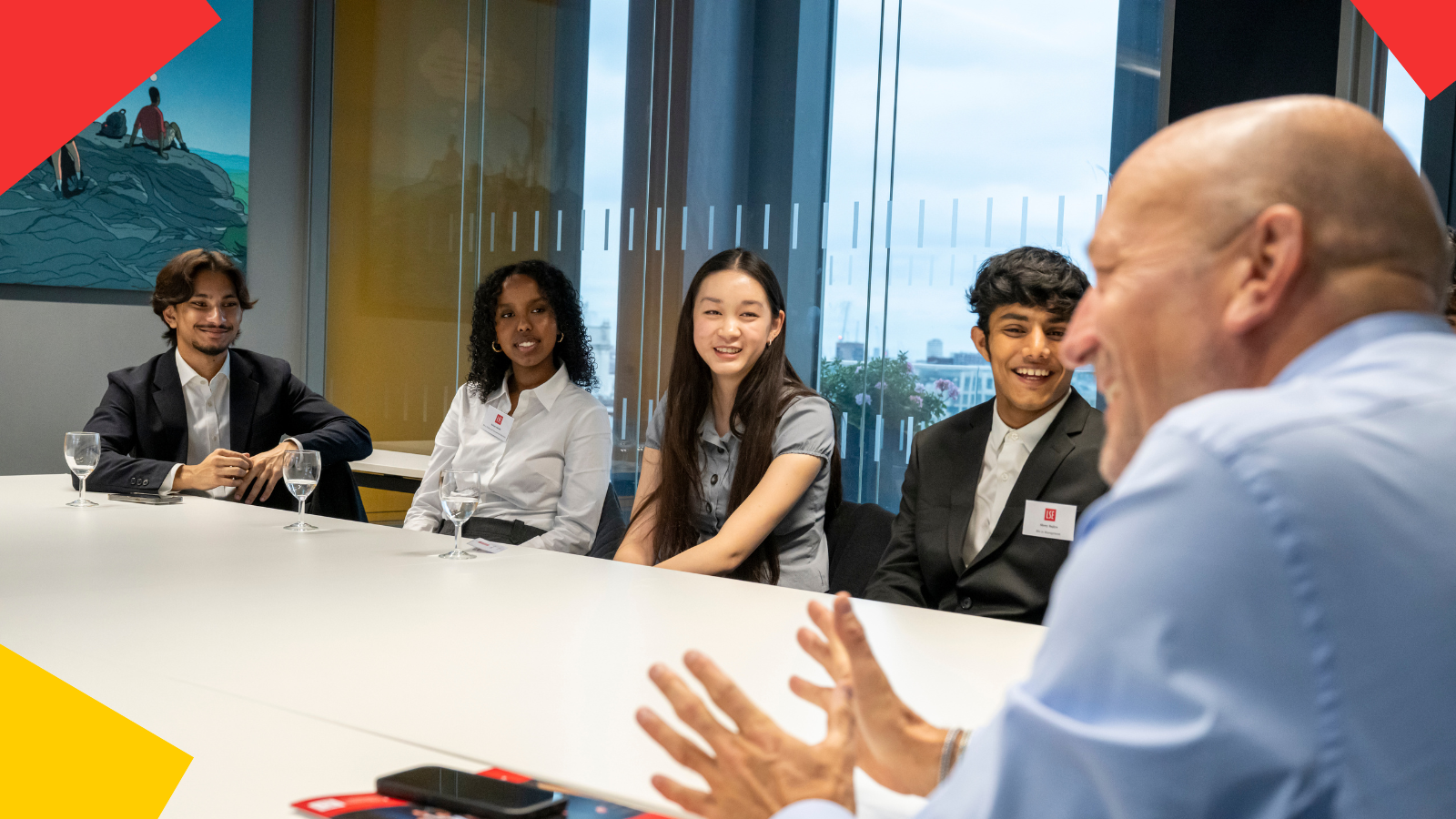 Uggla Family Scholars around a table