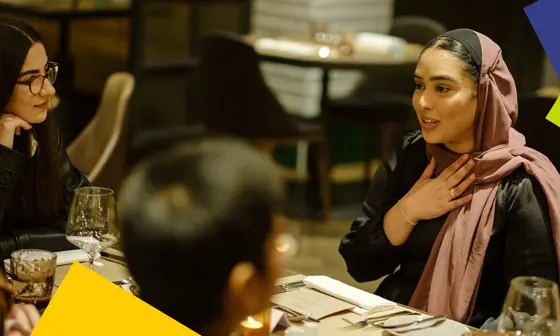 Uggla Family Scholars sit around a table