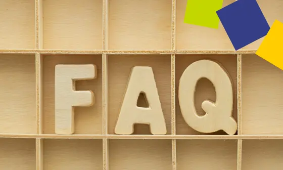 The letters 'FAQ' are displayed on a shelf