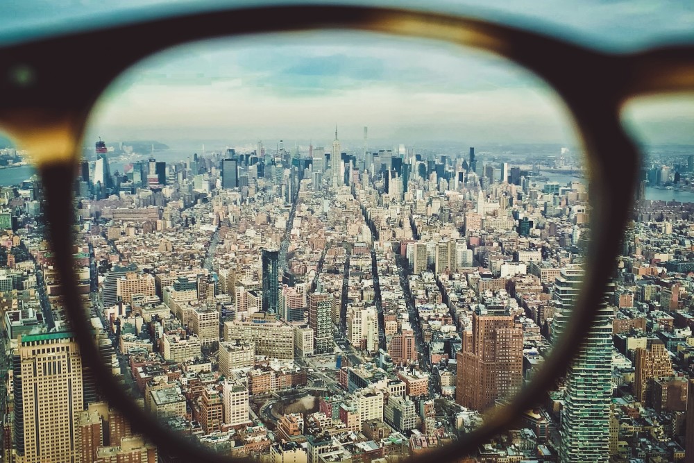 A view above New York City/Manhattan through a pair of glasses