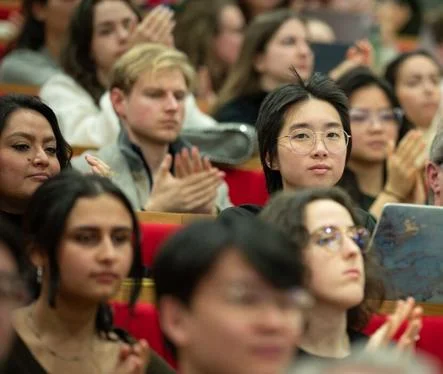Man looks directly to camera in audience