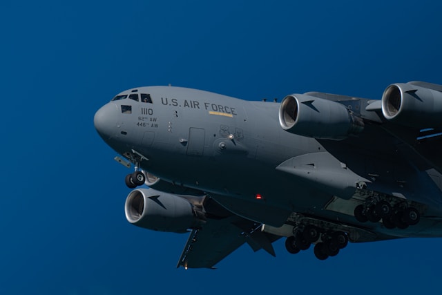 A US air force cargo plane against a blue sky background