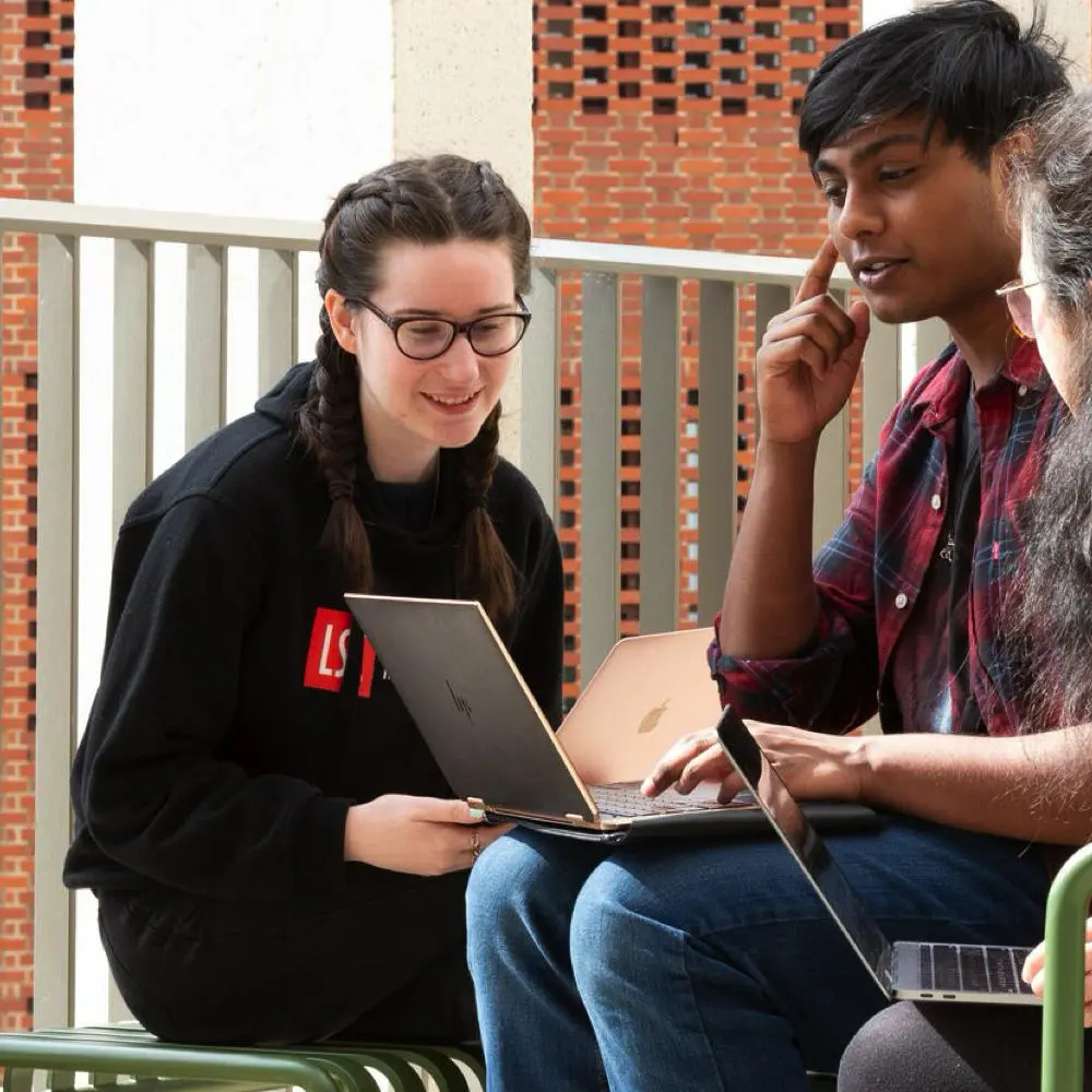 A group of LSE students sitting outside.