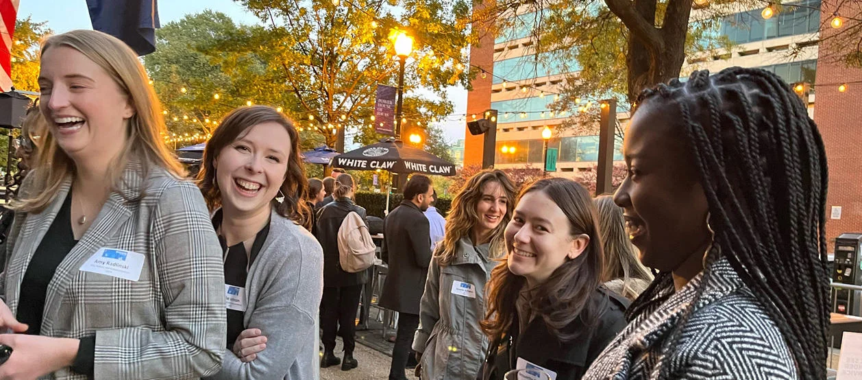 Attendees smile and laugh during a Welcome to the City event in Washintgon DC.