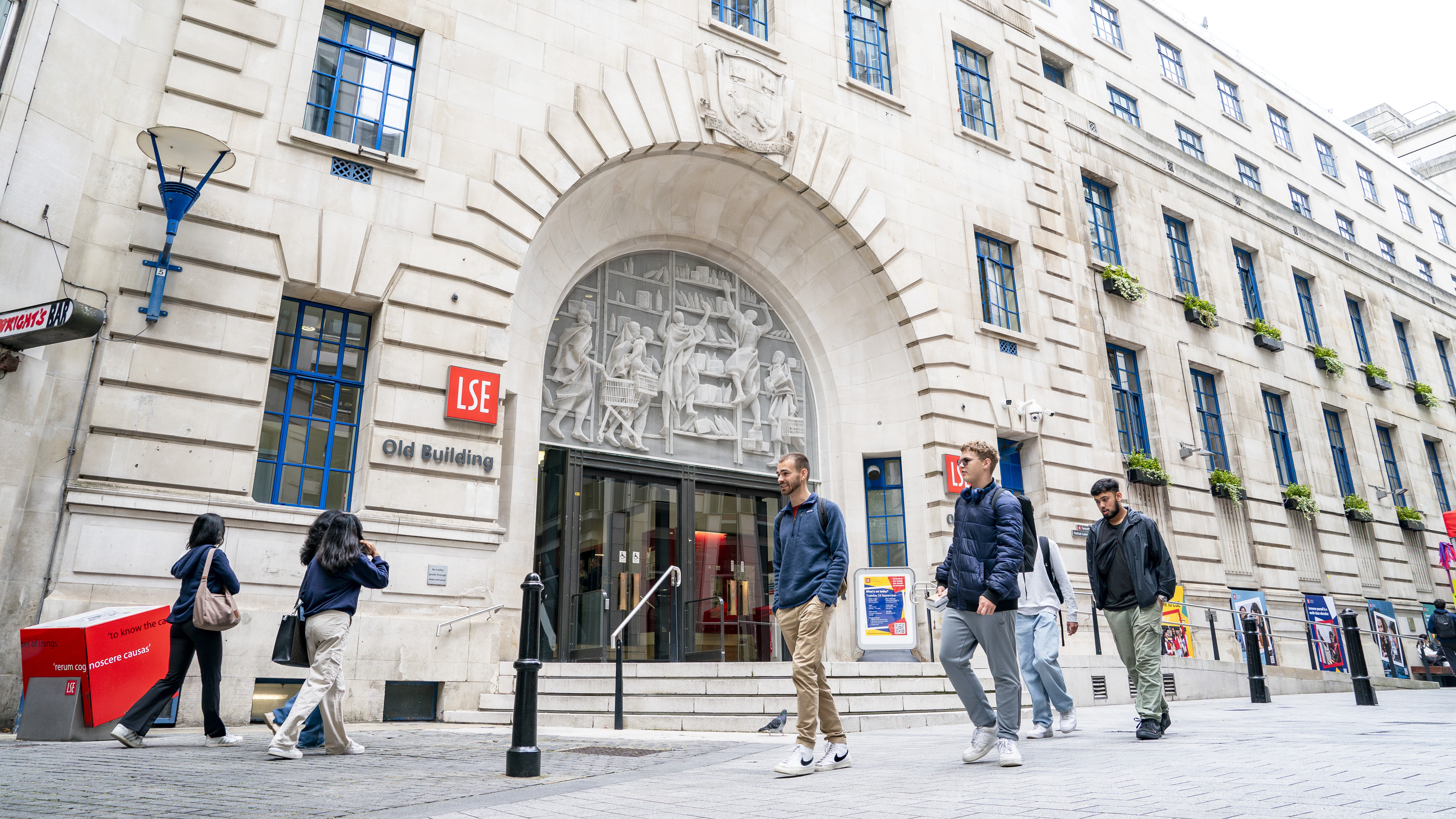 Students walking past the LSE Old Building entrance