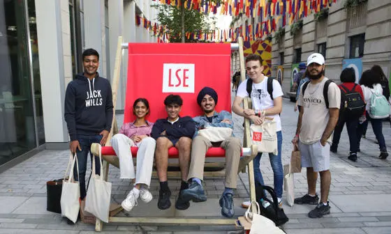 students sitting in a giant deckchair