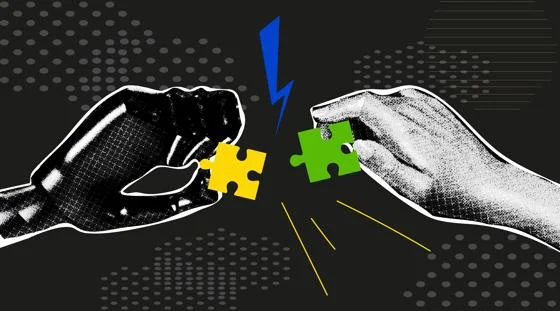 robot hand and human hand complete a jigsaw