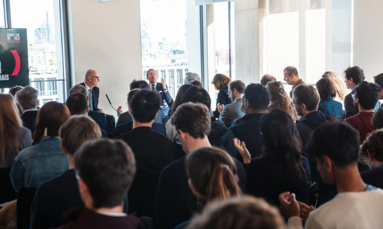  French Finance Minister Roland Lescure and Professor Camille Landais in front of audience
