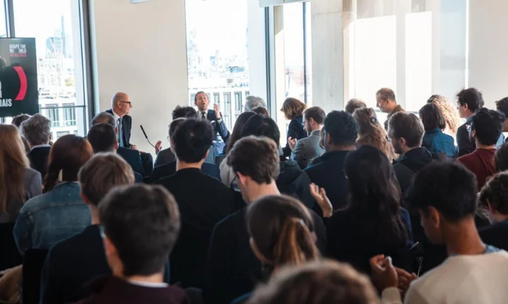 French Finance Minister Roland Lescure and Professor Camille Landais in front of audience