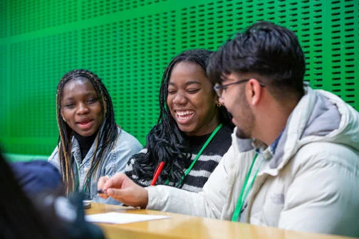 Three participants laughing during a WP campus visit