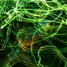 an abstract image of green and red lights on a black background