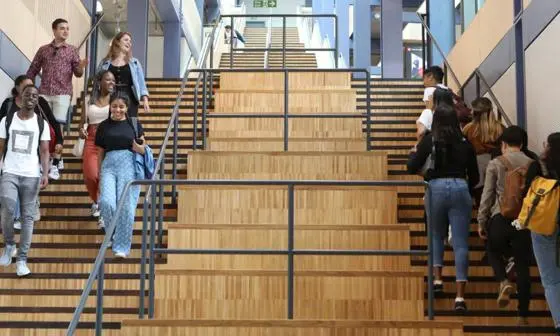 Students on stairs on campus
