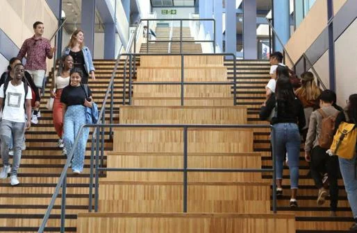 Students on stairs on campus