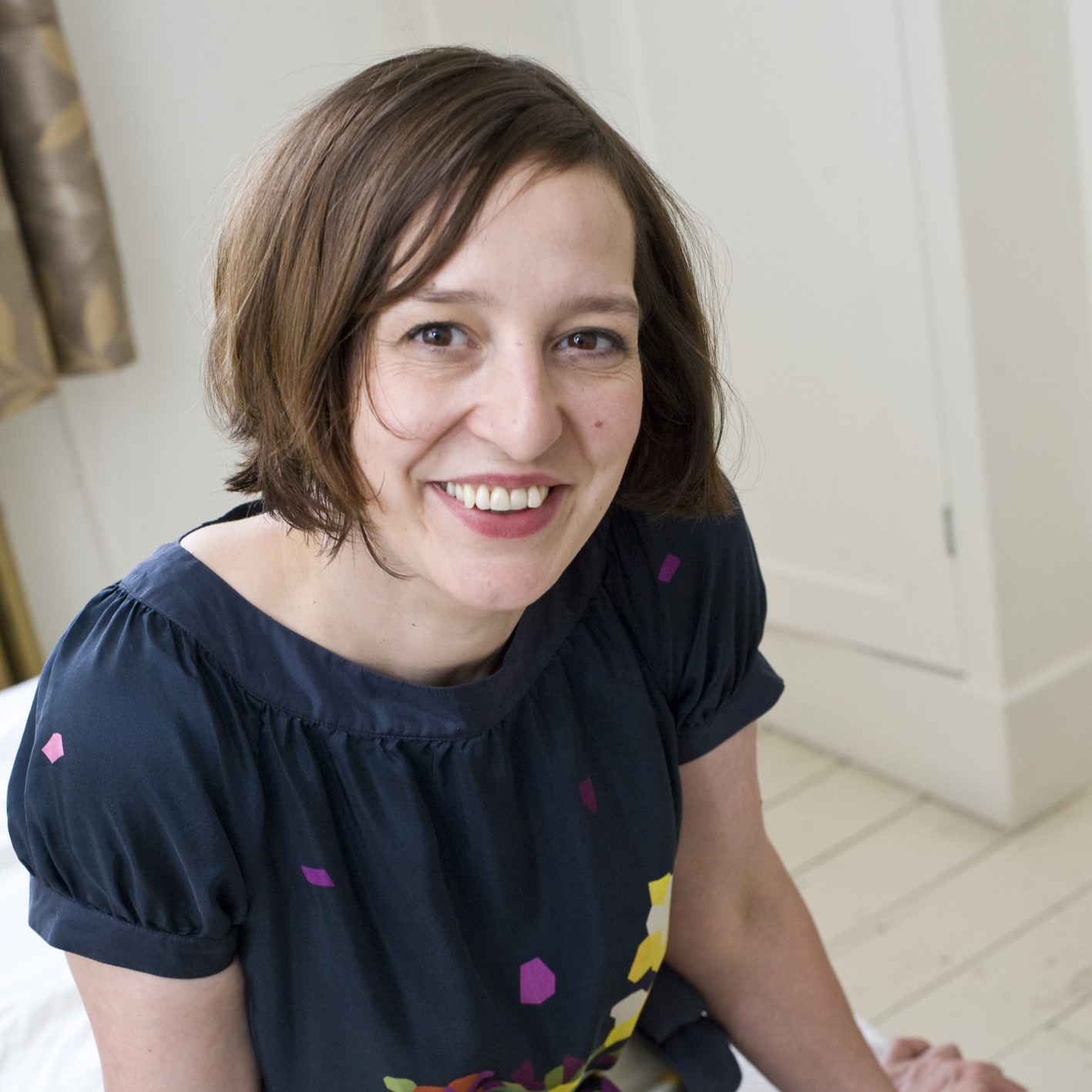 Headshot of Zoe wearing blue dress