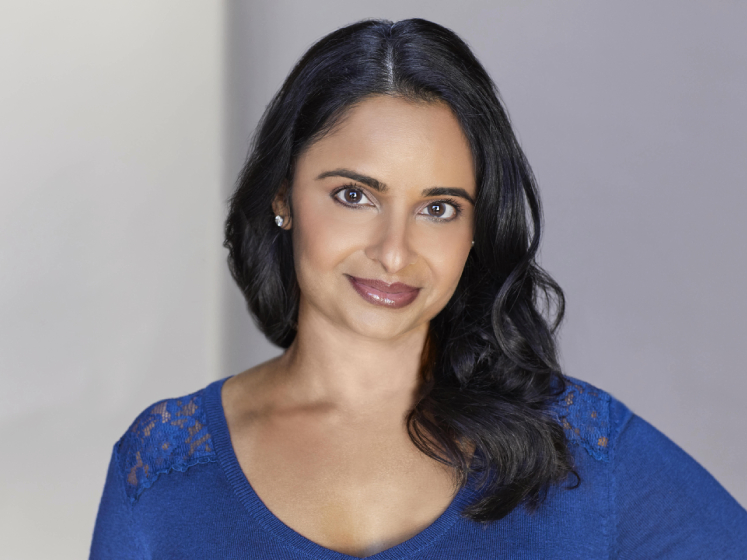 Profile image of Mansi Shah showing her wearing a blue top against a white background