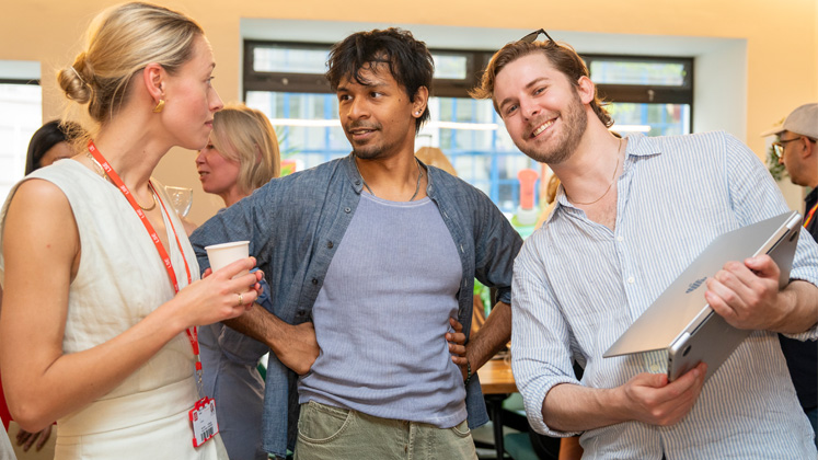 Three entrepreneurs chat during an LSE Generate event