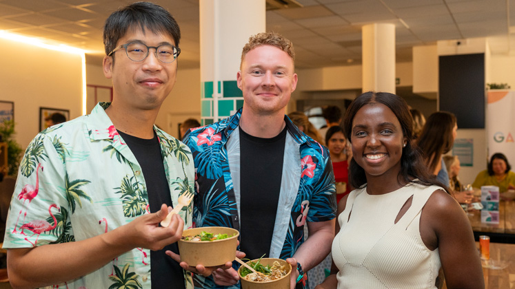 LSE Generate members enjoy food during an event