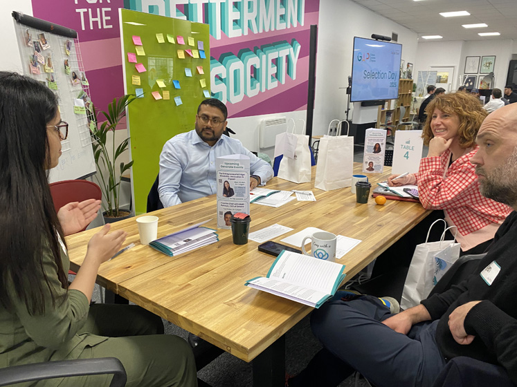 Accelerator participants chat during a group session