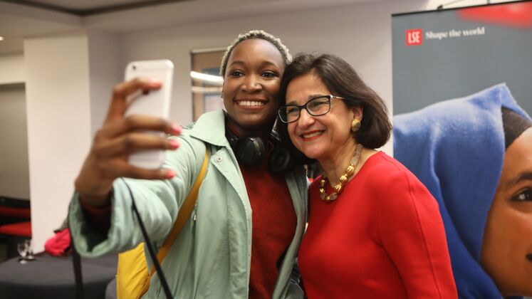 A woman takes a selfie with LSE Director Minouche Shafik