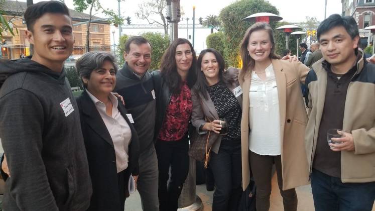 A group of LSE alumni pose for a group photo