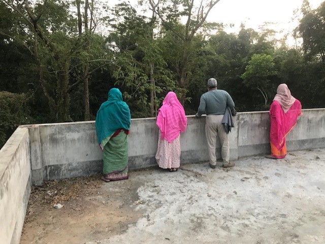 KG people looking out over building terrace