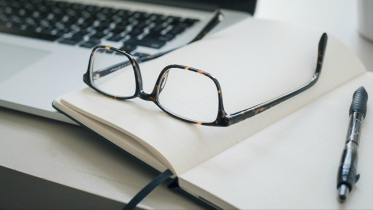 Notebook with glasses