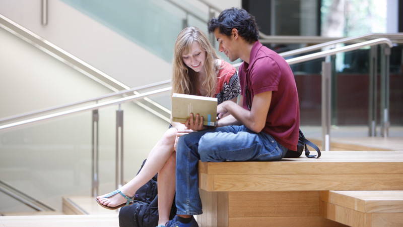 Students reading LSE new building