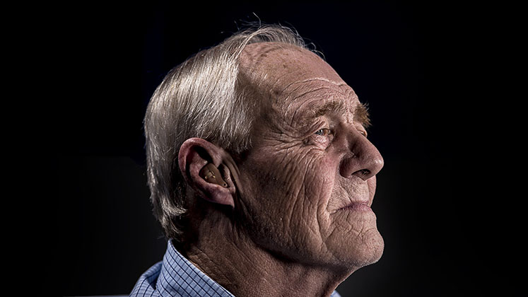 elderly_man_black_background_747x420