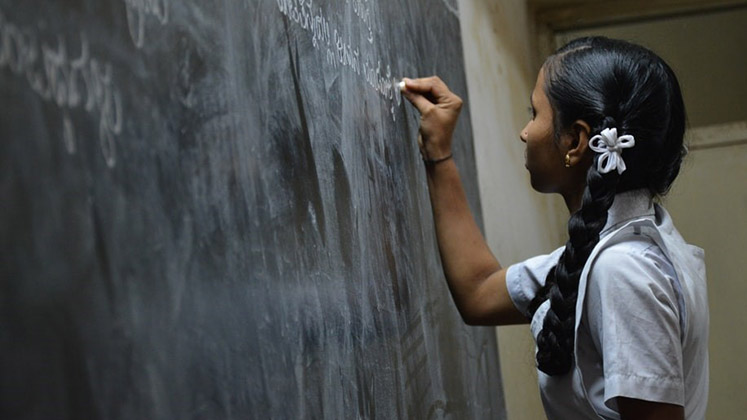 indian_girl_writing_blackboard_747x420