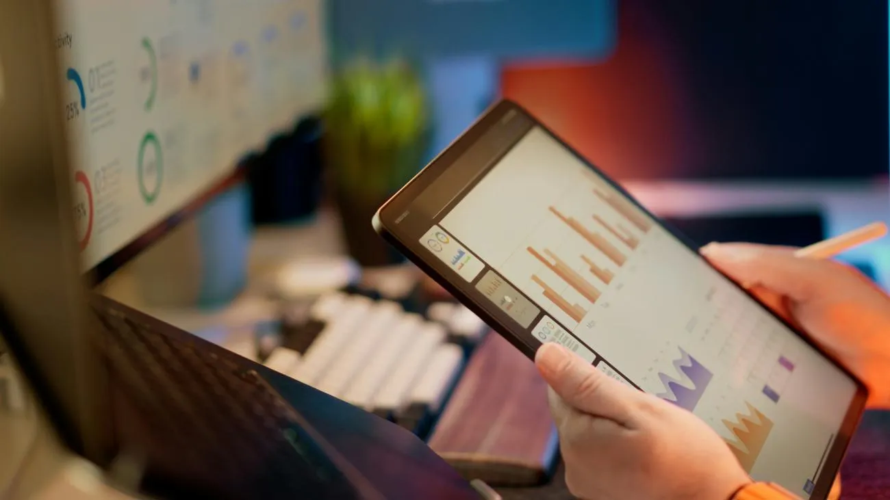 person holding ipad